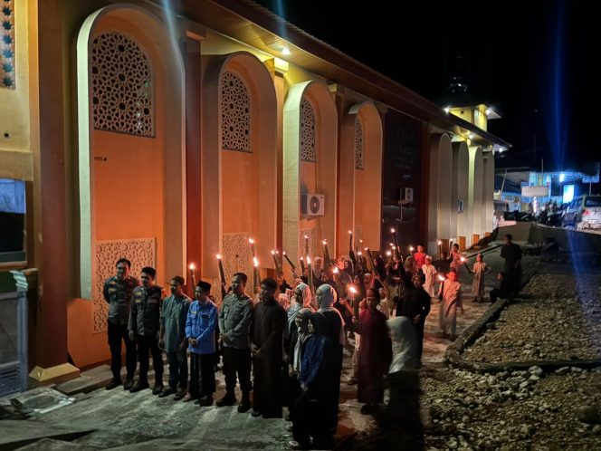 
 Ka SPKT III Polsek Amali Pimpin Pengawalan dan Pengamanan Pawai Obor Remaja Mesjid Syuhada